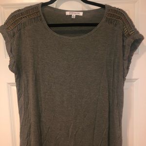Shoulder length casual top with shoulder details.